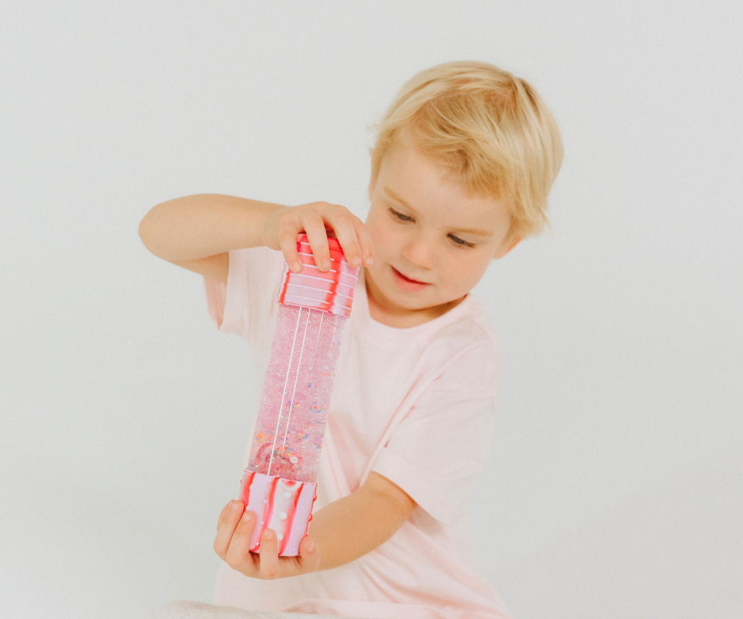 Girl playing with sensory bottle