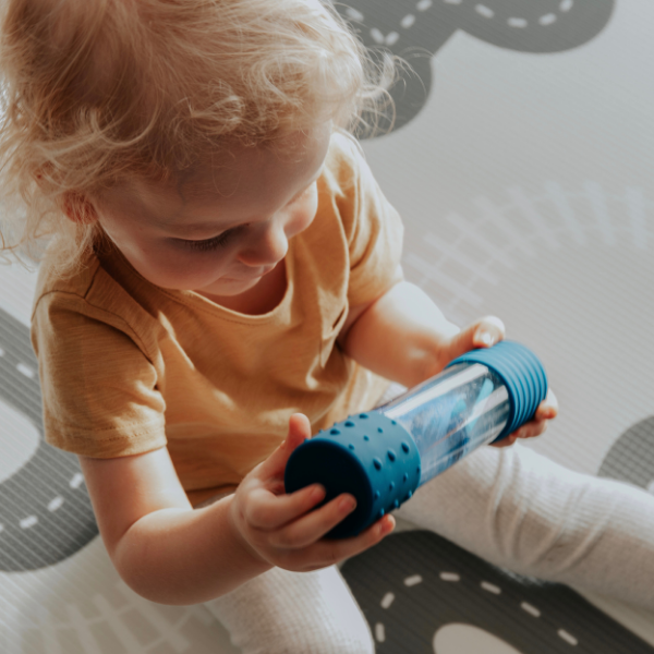 Boy playing with DIY Calm Down Bottle