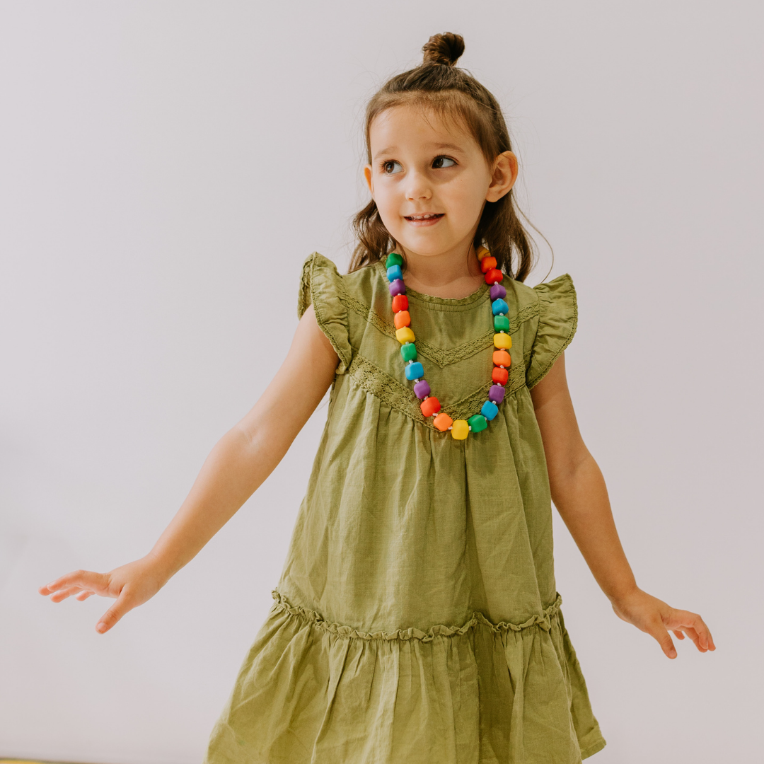 Girl wearing Rainbow Princess and the Pea Necklace