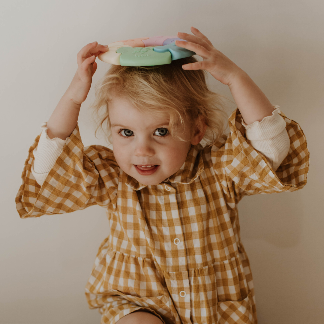 Baby girl with a colour wheel on her head