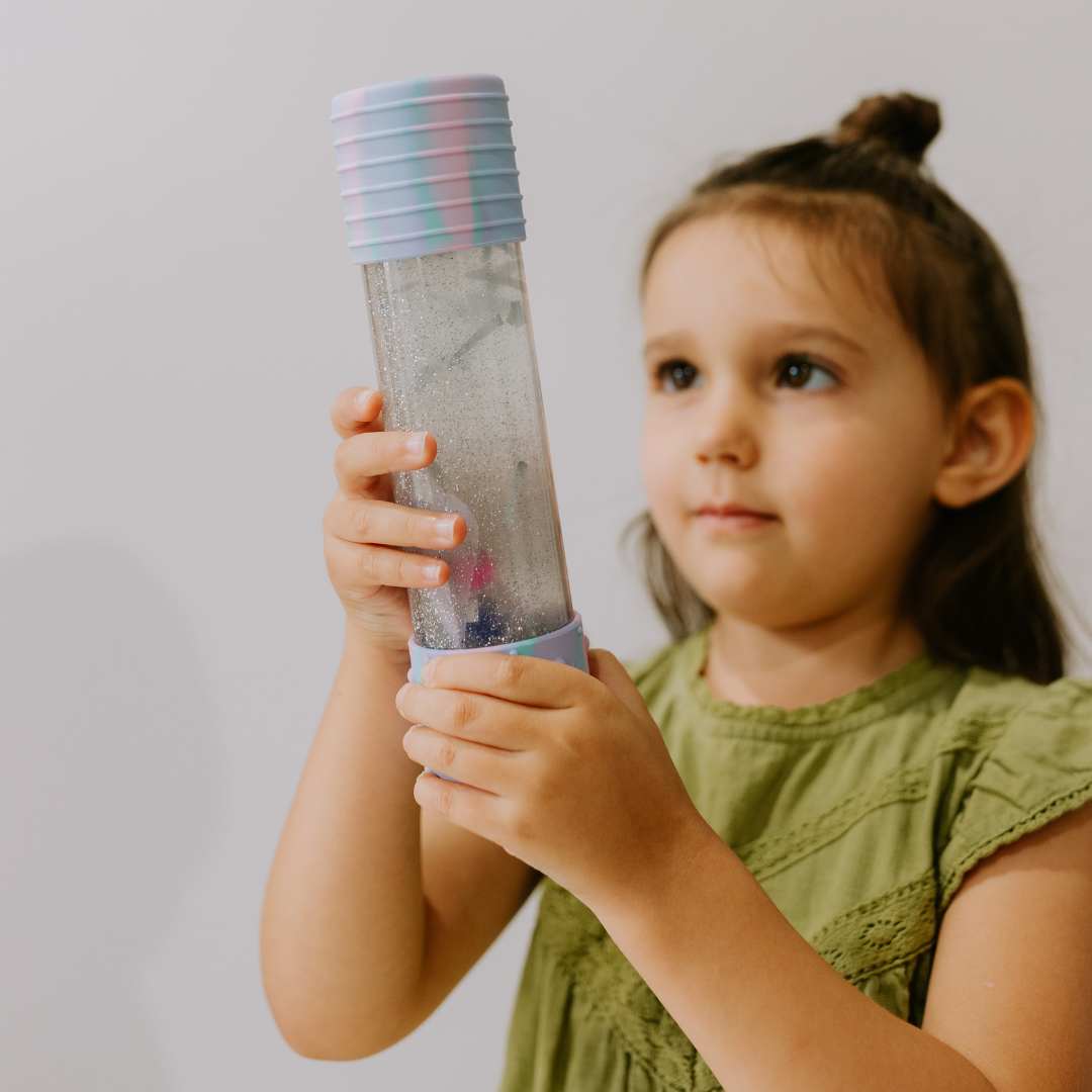 Girl holding unicorn calm down bottle