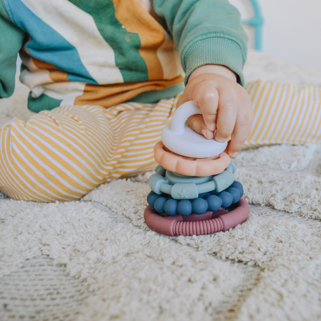 Boy playing with stacker toy