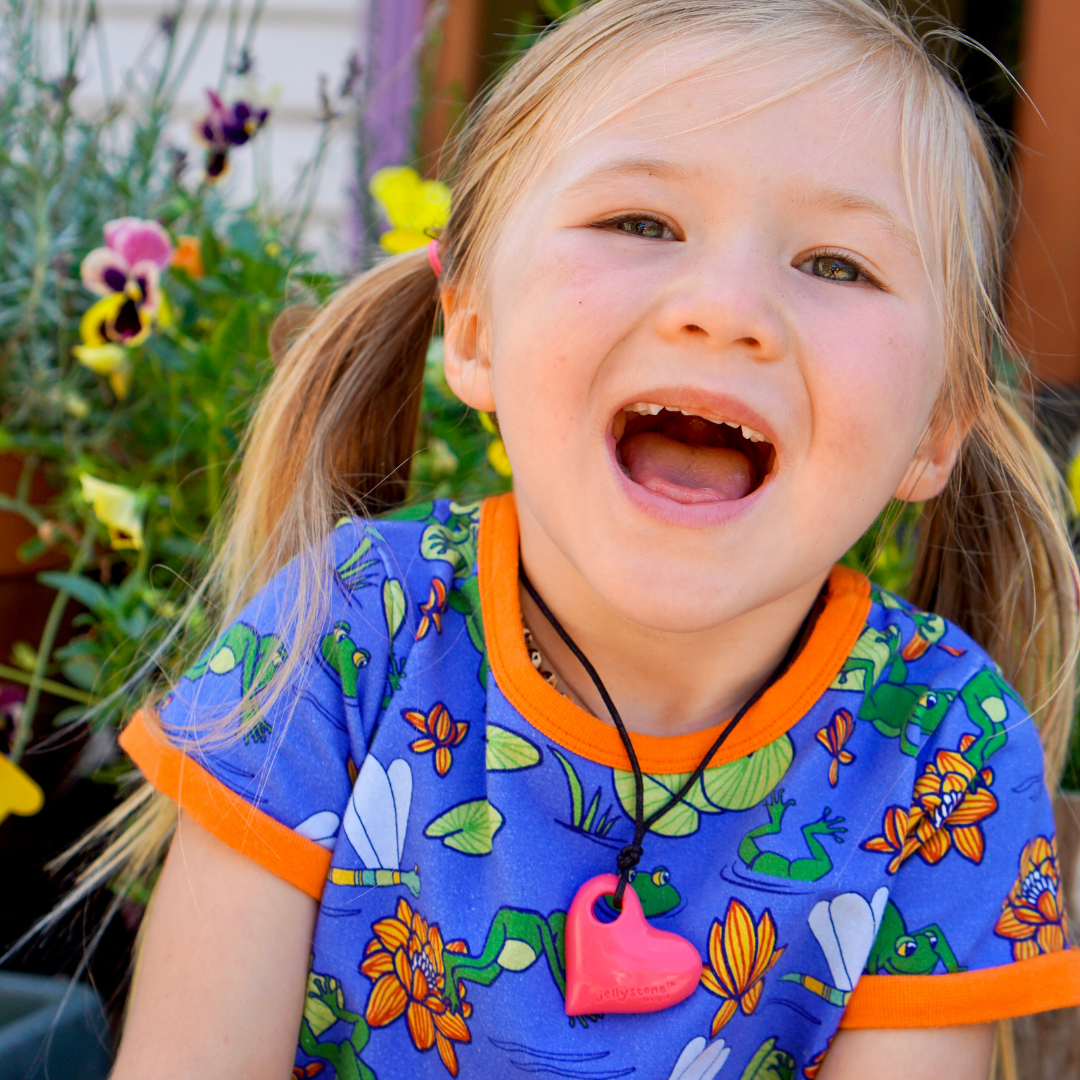 Girl wearing heart pendant