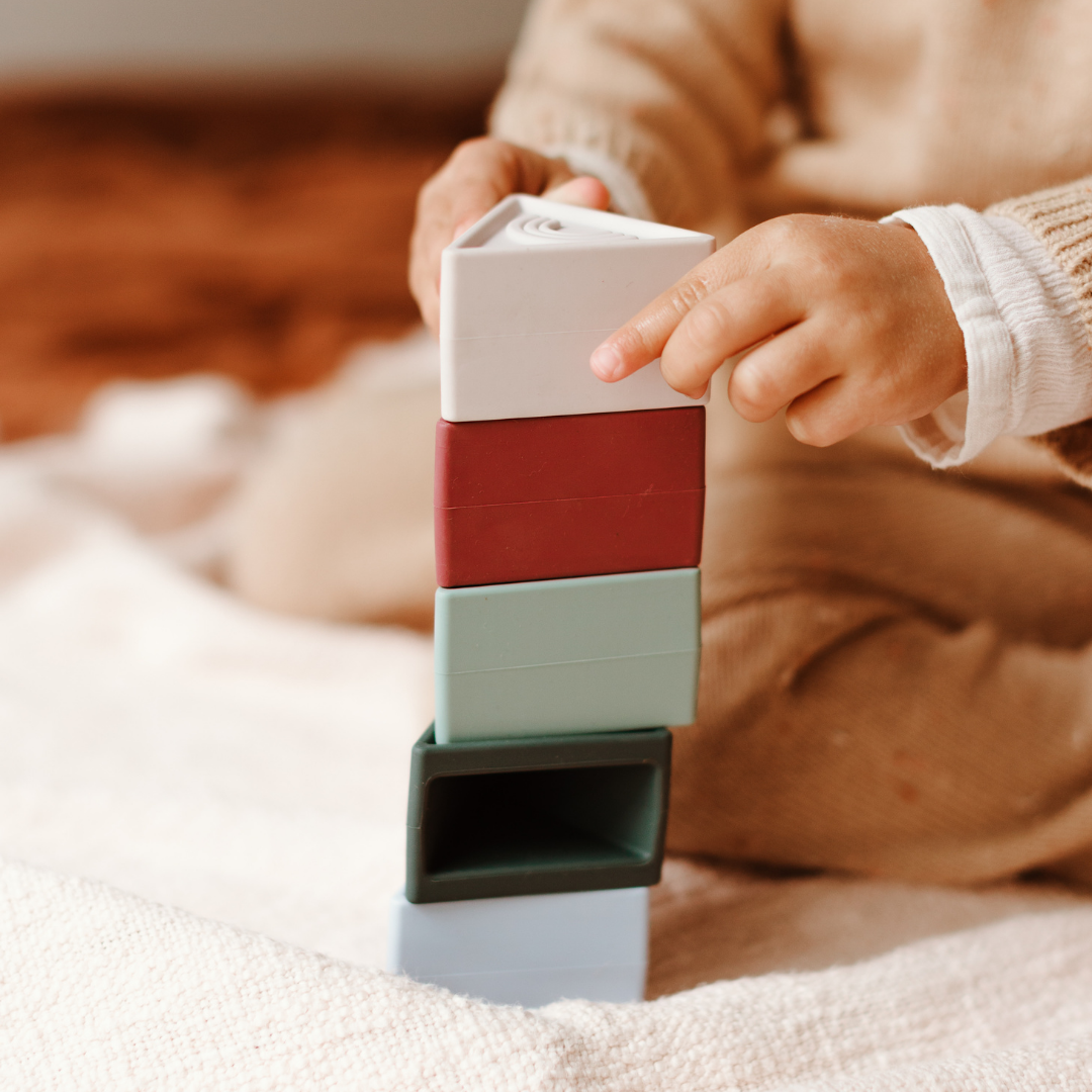 Close up of girl stacking triblox